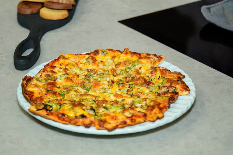 Supreme loaded pizza with multiple toppings at Green lantern pizza