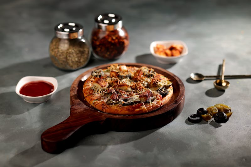 BBQ chicken pizza with crispy crust and smoky sauce